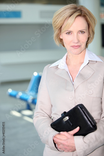 Photo: Businesswoman waiting at airport Businesswoman waiting at airport