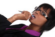 Woman chewing pen whilst thinking