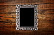 silver frame on a wood background silver frame on a wood background