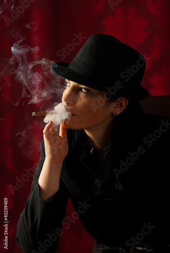 Photo: Smoking woman looking away Smoking woman looking away