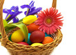 Colorful painted easter eggs in brown basket Colorful painted easter eggs in brown basket