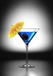 Blue Martini Cocktail with cocktail umbrella and cherry Blue Martini Cocktail with cocktail umbrella and cherry