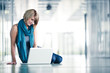 Pretty young female student with a laptop computer on college/un