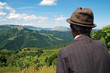 Old farmer in the meadow at spring