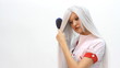 Beautiful young woman combing her hair Beautiful young woman combing her hair