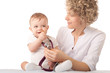 Pediatrician examining baby with stethoscope.