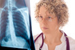 Female doctor examining an x-ray image Female doctor examining an x-ray image