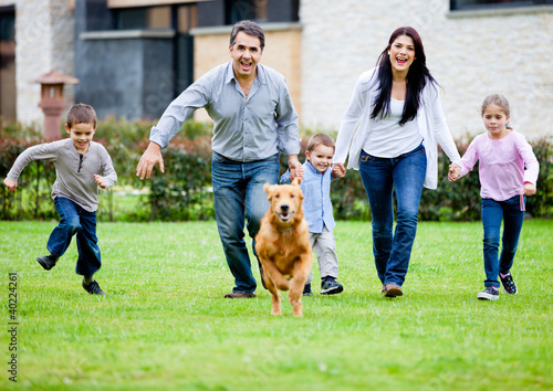 Photo: Family running with dog Family running with dog