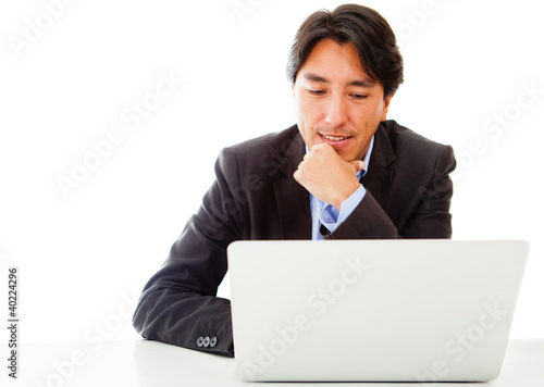 Foto: Businessman working on a laptop Businessman working on a laptop