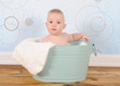 Photo: bright baby boy sitting in washtub bright baby boy sitting in washtub
