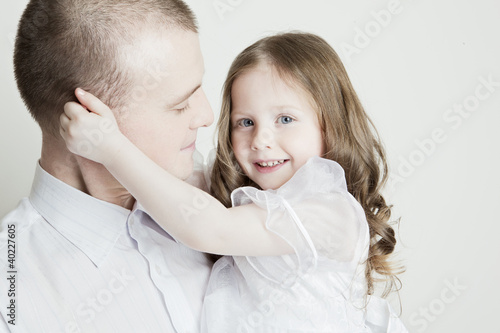 Photo: Portrait of beautiful smiling family: father and daughter Portrait of beautiful smiling family: father and daughter