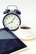 Coffee cup and alarm clock