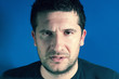 Photo: Close up portrait of real man. Undefined face expression Close up portrait of real man. Undefined face expression