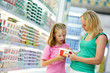 woman and girl making shopping