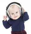 Foto: young child with ear-phones listening to music young child with ear-phones listening to music
