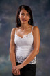 Photo: Pretty woman in white blouse looking thoughtfully at the camera Pretty woman in white blouse looking thoughtfully at the camera