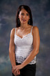 Photo: Pretty woman in white blouse looking thoughtfully at the camera Pretty woman in white blouse looking thoughtfully at the camera