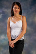 Photo: Pretty woman in white blouse looking thoughtfully at the camera Pretty woman in white blouse looking thoughtfully at the camera