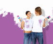 Young couple with paint brushes together