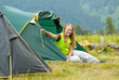 Happy  hiker in camp tent