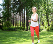 Photo: Young girl in a white shirt and red pants Young girl in a white shirt and red pants