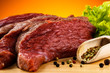 Raw beef on cutting board and vegetables Raw beef on cutting board and vegetables