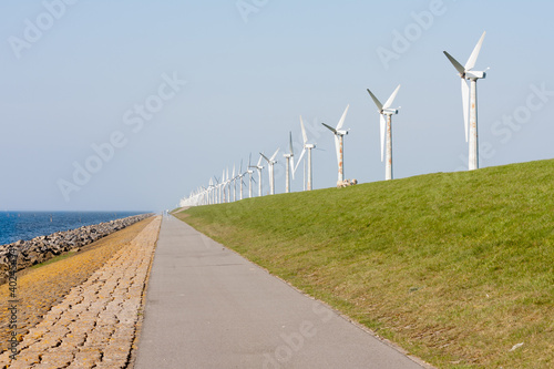 Photo: Wind turbines along a Dutch dike Wind turbines along a Dutch dike