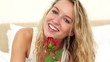 Video: Blonde haired woman smelling a red rose Blonde haired woman smelling a red rose