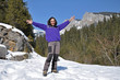Portrait of a young woman at winter in the mountains