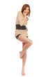 Foto: A beautiful barefoot girl on a white background. A beautiful barefoot girl on a white background.
