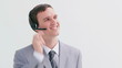 Smiling call centre agent talking into his headset
