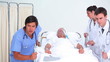Serious medical team transferring a patient