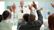 Business people raising their hands together