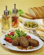 Beef cutlets with tomatoes and salad