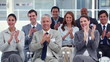 Business people applauding during a meeting