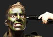 portrait of young soldier comiting suicide over black background