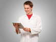 portrait of young academic holding a digital tablet over grey ba