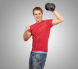 young man doing fitness with weights over grey background young man doing fitness with weights over grey background