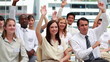 Two business people raising their hands