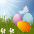Illustration: colorful Easter Eggs sitting on grass field with blue sky backgr colorful Easter Eggs sitting on grass field with blue sky backgr