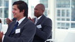Business audience applauding in rhythm 