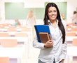 portrait of young woman holding notebook on classroom portrait of young woman holding notebook on classroom