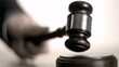 Hand pounding gavel in super slow motion