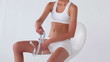 Woman using a tape on her thigh