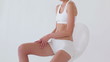 Video: Woman massaging her thigh Woman massaging her thigh