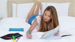 Video: Serious young woman studying while lying Serious young woman studying while lying
