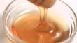 Honey in a bowl in super slow motion