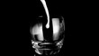Milk filling a glass in super slow motion a glass