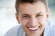 Foto : Young man smiling, close-up, portrait Young man smiling, close-up, portrait