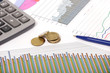 graphics with pen and calculator and coins graphics with pen and calculator and coins